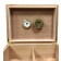 Close up of an humidor and its adjustable divider,gold humidifier and gold hygrometer