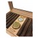 Close-up of a humidor showing golden humidifier, hygrometer and 8 cigars inside