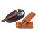 A two-finger leather cigar case with two cigars and a solid wood ashtray with a cigar on top