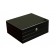 A closed black lacquer humidor with routed linear designed