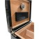 Close-up of the inside of the humidor showing a black humidifier and a black and silver hygrometer
