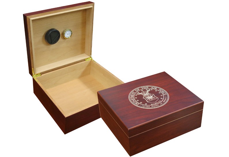 Two humidors in cherry finish one is open showing a humidifier and hygrometer the other one is closed with the air force emblem engraved on top