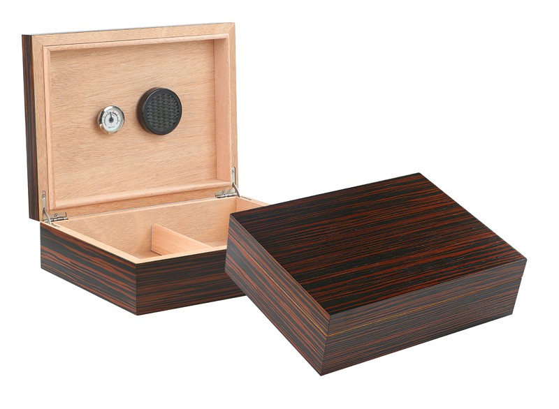 Two ebony wood humidors one is open showing the humidifier, hygrometer and adjustable divider, the other one is closed