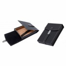 Two small black leather humidors with a black leather strap and a magnetic latch, one is open showing the interior the other one is closed.