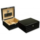 Two black lacquer humidors one is closed the other one is open showing a  black humidifier and a black and silver hygrometer