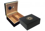 Two humidors in black finish one is open showing a humidifier and hygrometer the other one is closed with the US Coast Guard engraved on top