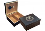 Two humidors in black finish one is open showing a humidifier and hygrometer the other one is closed with the air force emblem engraved on top