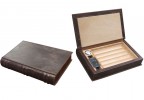 Two leather book-like humidors one is closed the other one is open showing a hygrometer, humidifier and guillotine cutter