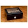 A closed small glass humidor in black finish with see through glass on top and an external hygrometer displaying ten cigars through the glass 