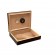 An open humidor with dark mahogany wood exterior showing the humidifier and hygrometer
