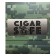 Close-up of the words cigar safe over a grey plaque engraved on the lid of a travel humidor with camouflage exterior