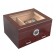 Glass top humidor in cherry finish with an external hygrometer and two drawers closed