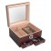 An open glass top humidor in cherry finish showing five cigars inside, an external hygrometer and two drawers open with accessories