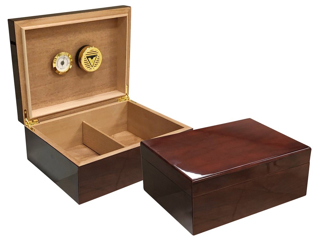 Two humidors with dark mahogany wood exterior one is closed the other one is open showing an adjustable divider and a golden hygrometer and humidifier