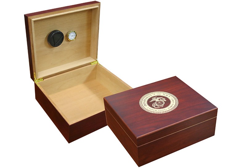 Two humidors in cherry finish one is open showing a humidifier and hygrometer the other one is closed with the marines logo engraved on top