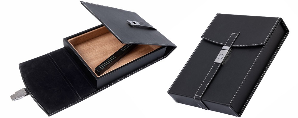 Two small black leather humidors with a black leather strap and a magnetic latch, one is open showing the interior the other one is closed.