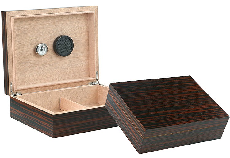 Two ebony wood humidors one is open showing the humidifier, hygrometer and adjustable divider, the other one is closed