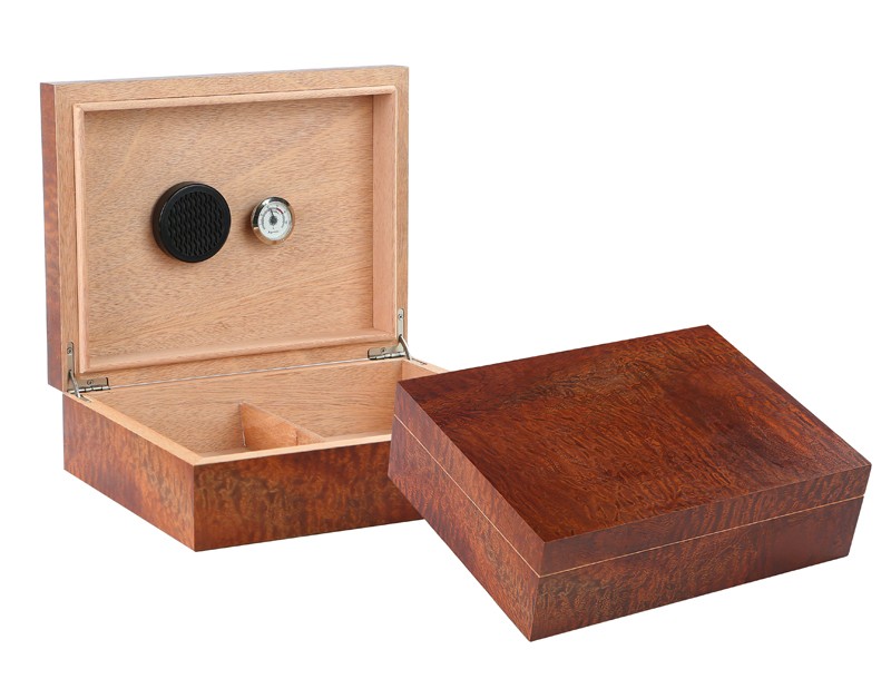 Two Makore Pommel wood humidors one is open showing the humidifier, hygrometer and adjustable divider, the other one is closed