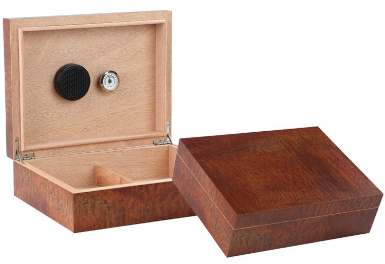 Two Makore Pommel wood humidors one is open showing the humidifier, hygrometer and adjustable divider, the other one is closed