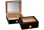 Two small and elegant glass humidors in black with see through glass on top and an external hygrometer, one humidor is closed and the other one is open